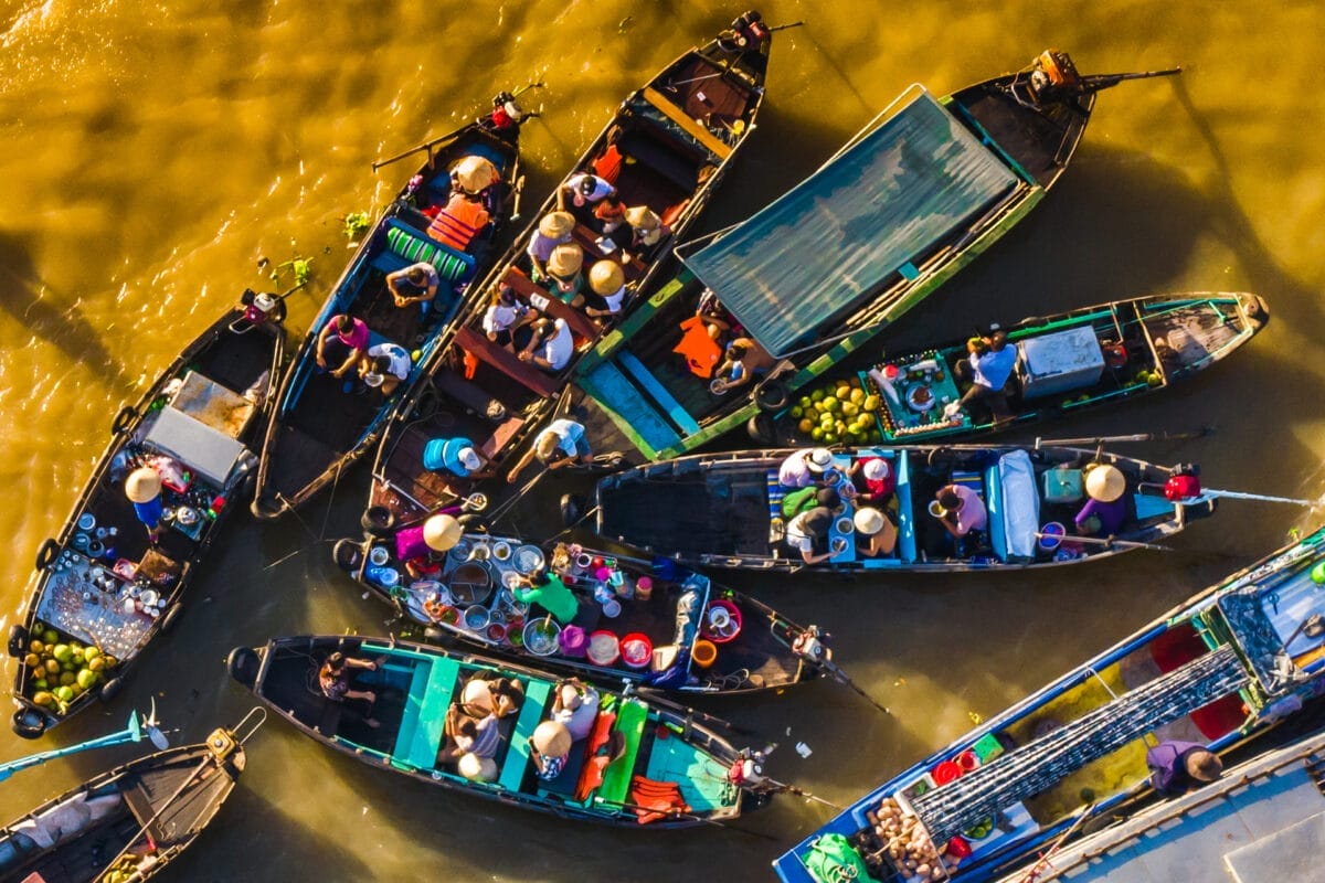 Top Attractions Along the Mekong River – Discover Hidden Gems cai-rang-floating-market-in-can-tho-6 Top Attractions Along the Mekong River – Discover Hidden Gems
